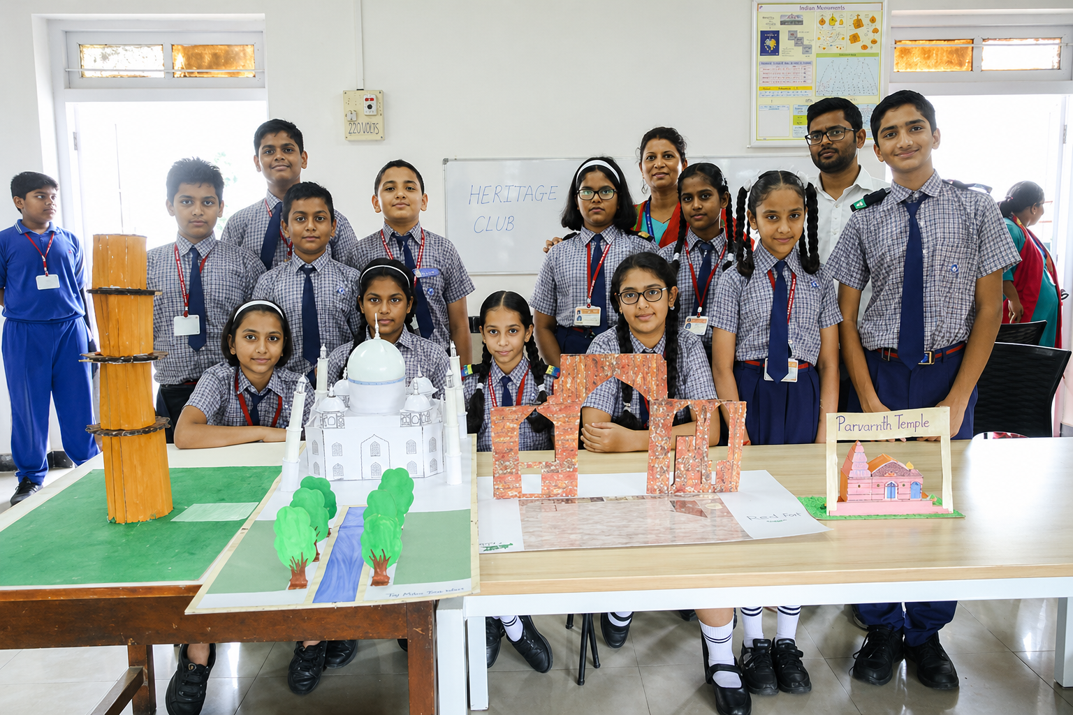 Students and teachers presenting creative science and classroom projects during a school activity session at Shri Harshad C. Valia International School.